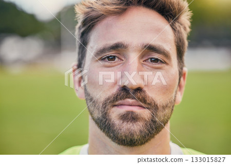 Rugby, field and portrait of man with serious expression, confidence and pride in winning game. Fitness, sports and zoom on face of player ready for match, workout or competition on grass at stadium. Rugby, field and portrait of man with serious expression, confidence and pride in winning game. Fitness, sports and zoom on face of player ready for match, workout or competition on grass at stadium. 133015827