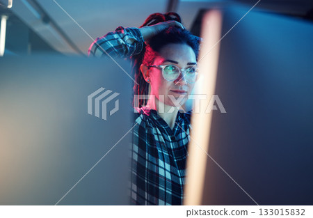 Cybersecurity, malware and woman hacker working on a computer in the basement at night for phishing. Database, password and ransomware with a female coder hacking a digital transformation network 133015832