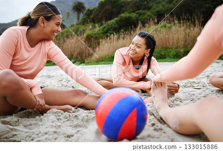 Volleyball, stretching and women with ball on beach ready to play match, competition and sports game. Teamwork, fitness and female players stretch on sand for warm up practice, training and exercise 133015886