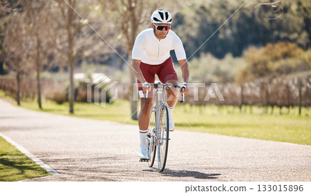 Man, athlete and bicycle travel in park, exercise and training of triathlon sports in sunshine. Cyclist, bike and outdoor cycling path for workout, summer fitness and journey of performance challenge 133015896