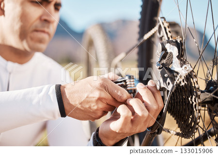 Hands, repair and wheel with man and bicycle for sports, wellness and fitness training. Insurance, safety and tire change with cyclist fixing mountain bike on trail for broken, puncture and check Hands, repair and wheel with man and bicycle for sports, wellness and fitness training. Insurance, safety and tire change with cyclist fixing mountain bike on trail for broken, puncture and check 133015906