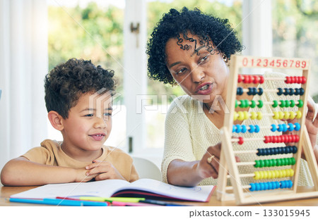 Abacus, grandmother or boy learning math kindergarten homework or school education in house. Numbers counting or serious senior woman teaching or helping a smart young boy student with development 133015945