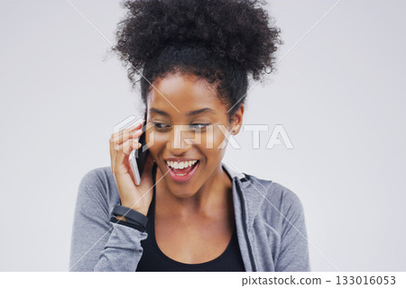 Phone call, funny and black woman talking in studio isolated on a white background with mockup. Cellphone, excited and African female person in communication, speaking or discussion, network or chat. 133016053