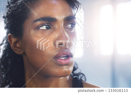 Sweating, woman and breathing while taking a break from fitness, exercise and workout. Gym, Indian female person and serious face of an athlete after sports and wellness club training for health Sweating, woman and breathing while taking a break from fitness, exercise and workout. Gym, Indian female person and serious face of an athlete after sports and wellness club training for health 133016113