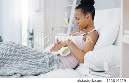 Woman, stomach pain and period cramps, hot water bottle for endometriosis, health problem and sick in bed. Female person with digestion issue at home, warmer to sooth abdominal ache and menstruation Woman, stomach pain and period cramps, hot water bottle for endometriosis, health problem and sick in bed. Female person with digestion issue at home, warmer to sooth abdominal ache and menstruation 133016259