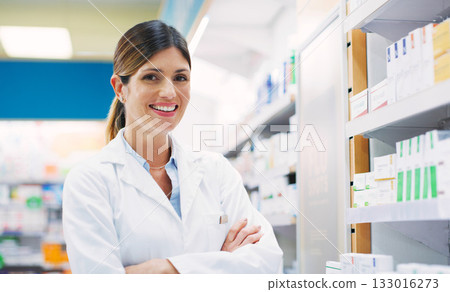 Store shelf, happy woman and pharmacist portrait with crossed arms, pride and chemist in drugs store, clinic or shop. Happiness, pharmacy product and healthcare person confident in pills dispensary Store shelf, happy woman and pharmacist portrait with crossed arms, pride and chemist in drugs store, clinic or shop. Happiness, pharmacy product and healthcare person confident in pills dispensary 133016273