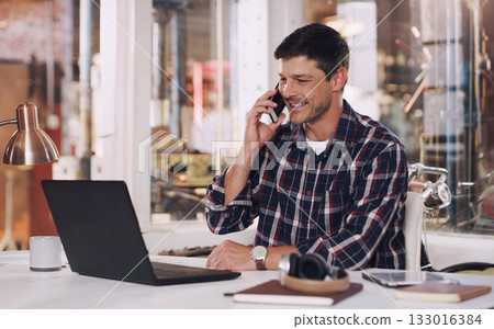 Phone call, laptop and male carpenter in the workshop doing research for a carpentry project. Communication, technology and man industrial worker on a mobile conversation working in warehouse office. 133016384
