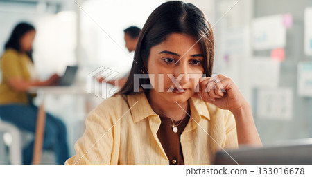 Woman, computer and review at startup in office, project management or decision at media company. Person, pc and serious with insight, perspective or problem solving with solution for job at agency 133016678