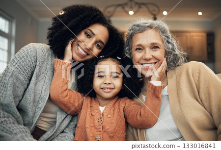 Love, family and portrait by girl with mother and grandmother on a sofa, happy and smile in their home. Bond, relax and face of senior woman with adult daughter and grandchild on couch on the weekend 133016841