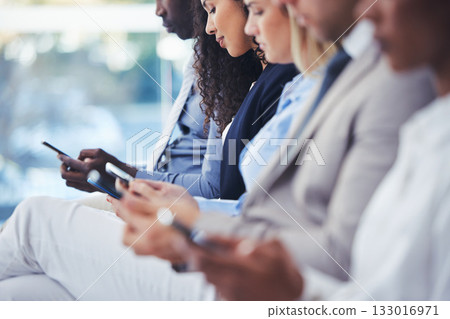 Business people, hiring and hands with phone in waiting room for networking, social media or communication at office. Group of employee workers wait in line or row with smartphone on recruitment app 133016971