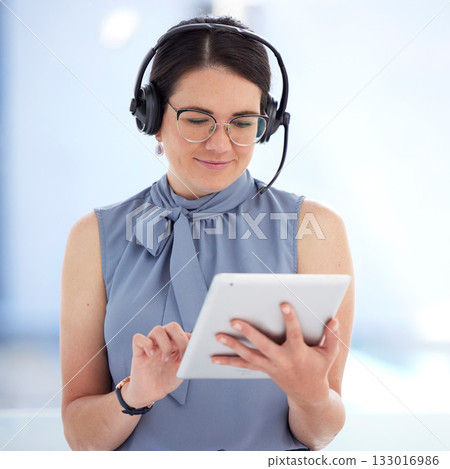 Tablet, customer service and support with a business woman doing a search on the internet to help a client. Research, contact and data with a female employee consulting using a headset in her office 133016986