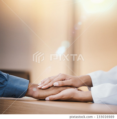 Holding hands, support and health with doctor and patient, cancer diagnosis and empathy with comfort for people. Trust, helping hand with hospital advice or medical results with healthcare insurance 133016989