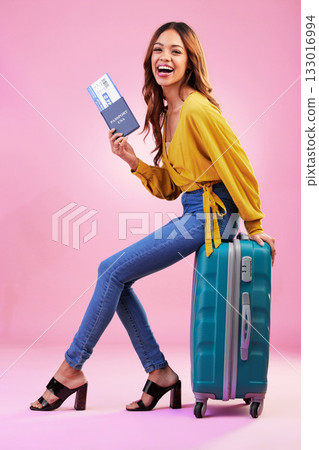 Luggage, passport and woman portrait isolated on pink background for USA travel vacation, immigration or holiday. Identity documents, flight ticket and happy, biracial person with suitcase in studio 133016994