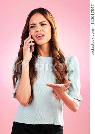 Annoyed, phone call and confused with woman in studio for angry, communication and bad news. Problem, conflict and frustrated with female isolated on pink background for negative, upset and contact 133017047