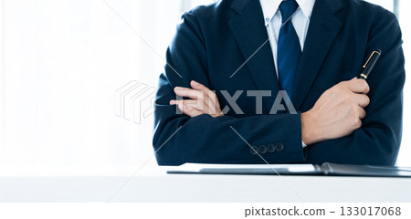 Businessman with arms folded 133017068