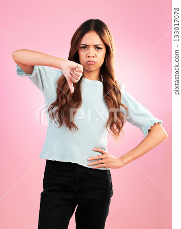 Portrait, thumbs down and hands of sad woman in studio for bad review, complaint or disappointed on pink background. Face, finger and emoji expression by girl with vote for wrong, bad news or reject Portrait, thumbs down and hands of sad woman in studio for bad review, complaint or disappointed on pink background. Face, finger and emoji expression by girl with vote for wrong, bad news or reject 133017078