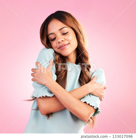 Happy woman, self love and inner peace hug in studio for body positivity, acceptance and joy on pink background. Smile, care and girl embracing authentic, natural and positive mindset while isolated Happy woman, self love and inner peace hug in studio for body positivity, acceptance and joy on pink background. Smile, care and girl embracing authentic, natural and positive mindset while isolated 133017096
