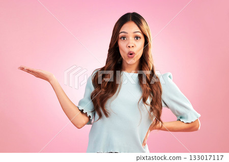 Woman, surprise and marketing in portrait with branding, product placement and promo on pink background. Advertising, logo and brand, mockup and female with wow face, hand out and display in studio 133017117