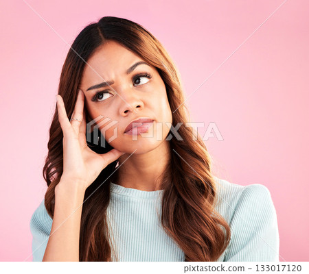 Thinking, burnout and annoyed woman in studio, tired and exhausted isolated on pink background. Mental health, doubt and irritated hispanic model, hand on head in confusion with problem or brain fog. Thinking, burnout and annoyed woman in studio, tired and exhausted isolated on pink background. Mental health, doubt and irritated hispanic model, hand on head in confusion with problem or brain fog. 133017120