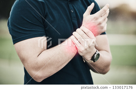 Sport, injury and golf, man with wrist pain during game on course, massage and outdoor relief in health and wellness. Green, hands on arm in support and golfer with ache from swing in golfing workout 133017176