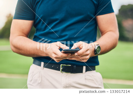 Man, hands and phone texting in communication on golf course for sports, social media or networking outdoors. Hand of sporty male chatting on smartphone or mobile app for golfing research or browsing 133017214