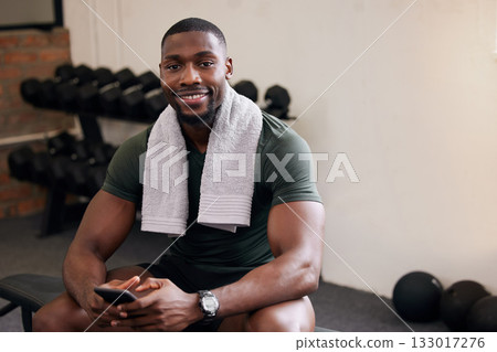 Gym, phone and portrait of happy man rest to check social media, search internet and workout progress app. Black male, sports break and mobile technology for fitness, smile and bodybuilder training Gym, phone and portrait of happy man rest to check social media, search internet and workout progress app. Black male, sports break and mobile technology for fitness, smile and bodybuilder training 133017276