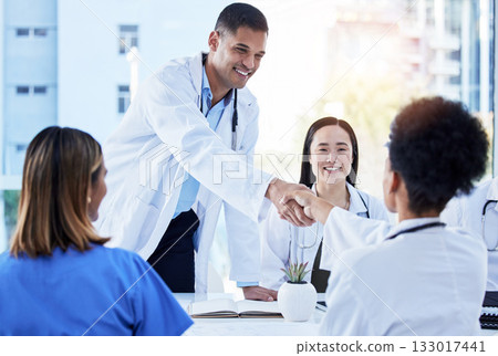 Handshake, doctors and medical meeting in agreement, collaboration and smile of teamwork, welcome or deal. Happy healthcare employees shaking hands in hospital partnership, greeting or clinic success Handshake, doctors and medical meeting in agreement, collaboration and smile of teamwork, welcome or deal. Happy healthcare employees shaking hands in hospital partnership, greeting or clinic success 133017441