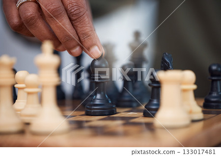 Man, chess and hands with bishop on board, strategy challenge and tournament games. Checkmate, chessboard and smart player playing in contest, problem solving and moving pieces to win competition 133017481
