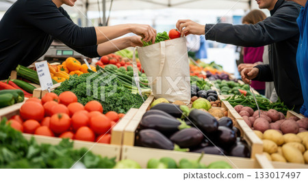 Person buying fresh organic vegetables at local farmers market, customer choosing healthy food from outdoor stall with colorful produce 133017497