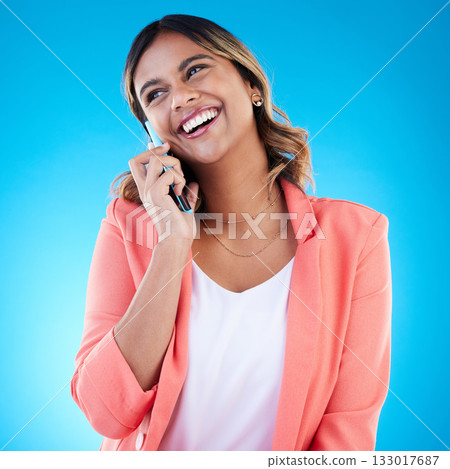 Phone call, talking and smile of business woman in conversation, chatting or communication in studio isolated on blue background. Cellphone, thinking or happy Indian female professional in discussion Phone call, talking and smile of business woman in conversation, chatting or communication in studio isolated on blue background. Cellphone, thinking or happy Indian female professional in discussion 133017687