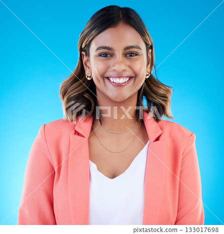 Smile, portrait and business woman in studio isolated on a blue background with pride for career, profession or job. Face, professional and confident, happy and proud female entrepreneur from India. Smile, portrait and business woman in studio isolated on a blue background with pride for career, profession or job. Face, professional and confident, happy and proud female entrepreneur from India. 133017698