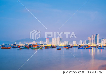 Traditional Vietnamese fishing boats at sea in Nha Trang city in Vietnam at sunrise in the morning in Asia 133017768