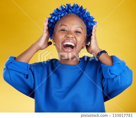 Portrait, queen and flower crown with an excited black woman in studio on a yellow background. Face, expression and sustainability with an attractive female wearing a blue wreath as royalty Portrait, queen and flower crown with an excited black woman in studio on a yellow background. Face, expression and sustainability with an attractive female wearing a blue wreath as royalty 133017781