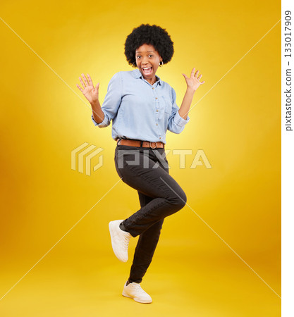 Wow, excited and portrait of black woman on yellow background with energy, happiness and smile in studio. Surprise mockup, celebration and isolated happy girl with discount news, deal and retail sale 133017909