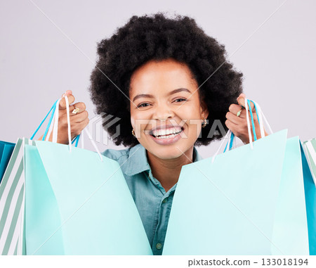 Shopping bag, retail portrait and happy black woman with luxury sales product, designer fashion deal or mall store present. Commerce market, discount gift and studio customer face on gray background Shopping bag, retail portrait and happy black woman with luxury sales product, designer fashion deal or mall store present. Commerce market, discount gift and studio customer face on gray background 133018194