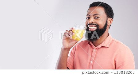 Orange juice, portrait and happy black man drinking with glass for hydration, liquid detox or weight loss. Vitamin C benefits, male nutritionist beverage and studio person on mockup gray background Orange juice, portrait and happy black man drinking with glass for hydration, liquid detox or weight loss. Vitamin C benefits, male nutritionist beverage and studio person on mockup gray background 133018203