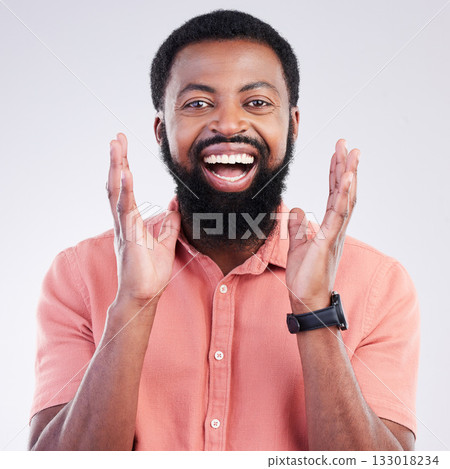 Happy, surprise and portrait of black man in studio for shocked, announcement and accomplishment. Smile, winner and achievement with male on gray background for celebration, omg and good news 133018234