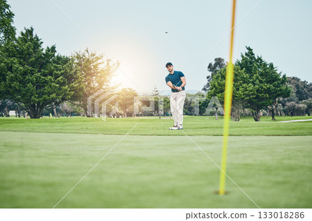 Grass, golf hole and man with golfing club on course for game, practice and training for competition. Professional golfer, sports and male athlete hit ball with club for winning, score or tee stroke Grass, golf hole and man with golfing club on course for game, practice and training for competition. Professional golfer, sports and male athlete hit ball with club for winning, score or tee stroke 133018286