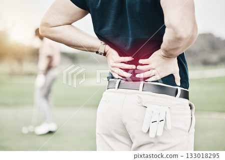 Sports, injury and man on golf course with back pain during game, massage and relief in health and wellness. Green, hands on spine in support and golfer with body ache at golfing workout on grass. Sports, injury and man on golf course with back pain during game, massage and relief in health and wellness. Green, hands on spine in support and golfer with body ache at golfing workout on grass. 133018295