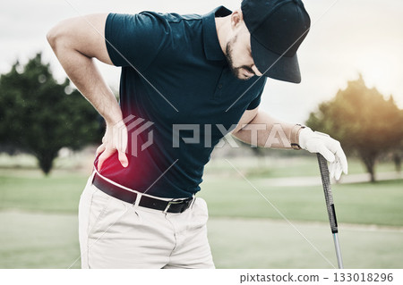 Sports, muscle and golf, man with back pain during game on course, massage and relief in health and wellness. Green, hands on injury in support and golfer with body ache at golfing workout on grass. Sports, muscle and golf, man with back pain during game on course, massage and relief in health and wellness. Green, hands on injury in support and golfer with body ache at golfing workout on grass. 133018296