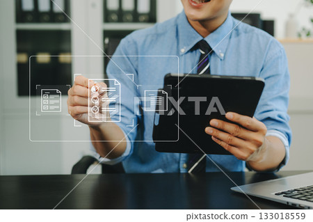 E-document management Paperless workplace, e-signing, electronic signature, document management. businessman signs an electronic document E-document management Paperless workplace, e-signing, electronic signature, document management. businessman signs an electronic document 133018559