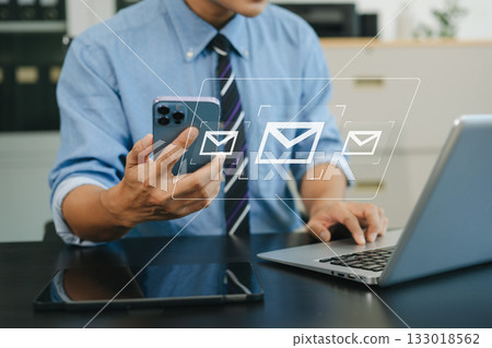 Woman hands using Laptop, tablet typing on keyboard and surfing the internet with email icon, email marketing concept, send e-mail Woman hands using Laptop, tablet typing on keyboard and surfing the internet with email icon, email marketing concept, send e-mail 133018562