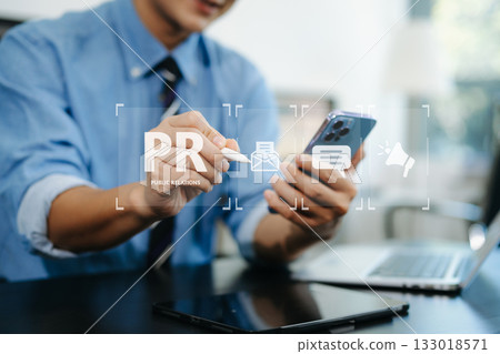 PR, Public relations concept. hands using laptop and tablet with public relations icon for communication advertising marketing strategy. PR, Public relations concept. hands using laptop and tablet with public relations icon for communication advertising marketing strategy. 133018571