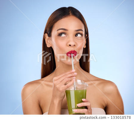 Beauty, smoothie and health with woman in studio for detox, nutrition and diet. Organic, drinking and minerals with girl model and green juice on blue background for vegan, fiber and protein Beauty, smoothie and health with woman in studio for detox, nutrition and diet. Organic, drinking and minerals with girl model and green juice on blue background for vegan, fiber and protein 133018578