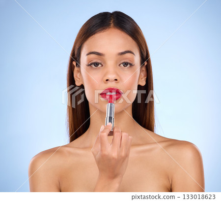 Red lipstick, beauty and makeup portrait of a woman or face for cosmetics in studio. Aesthetic female model on a blue background for self care, facial glow and color product application for lips 133018623