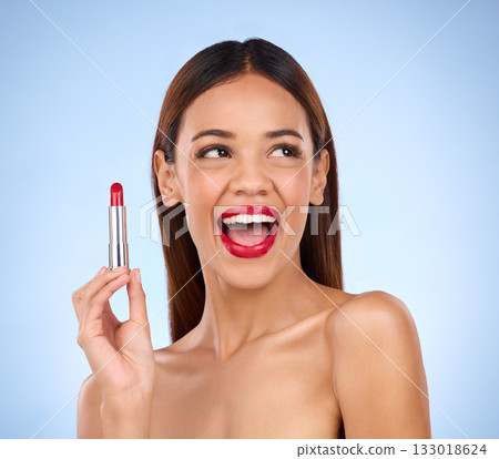 Beauty, red lipstick and makeup of woman thinking about skincare or cosmetics promotion in studio. Excited female model on a blue background for self care, facial glow and skin with product color Beauty, red lipstick and makeup of woman thinking about skincare or cosmetics promotion in studio. Excited female model on a blue background for self care, facial glow and skin with product color 133018624