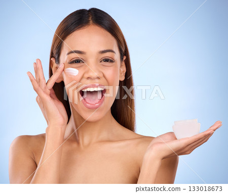 Woman, portrait and face moisturizer creme for beauty skincare cosmetics, self love or care against a blue studio background. Happy female with lotion or moisturizing cream for perfect skin or facial Woman, portrait and face moisturizer creme for beauty skincare cosmetics, self love or care against a blue studio background. Happy female with lotion or moisturizing cream for perfect skin or facial 133018673
