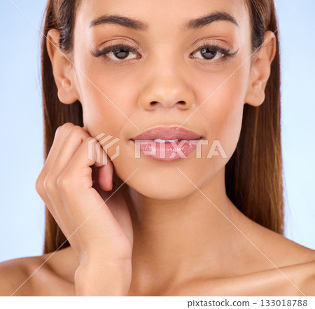 Face, beauty and makeup with woman in portrait, skincare and dermatology with natural cosmetics on blue background. Cosmetic care, wellness and skin glow with facial, female in studio and cosmetology Face, beauty and makeup with woman in portrait, skincare and dermatology with natural cosmetics on blue background. Cosmetic care, wellness and skin glow with facial, female in studio and cosmetology 133018788