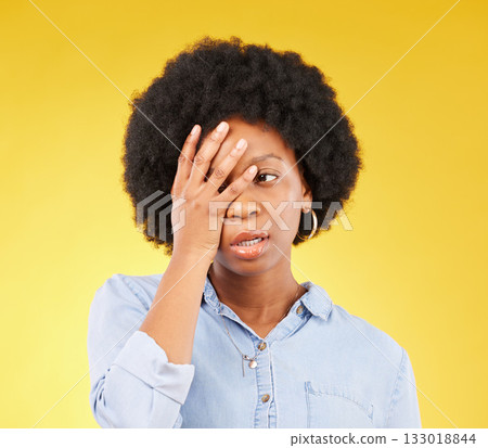 Frustrated, stress and angry with black woman in studio for tired, exhausted and mental health. Failure, bored and scared with female isolated on yellow background for difficulty, trouble and fear Frustrated, stress and angry with black woman in studio for tired, exhausted and mental health. Failure, bored and scared with female isolated on yellow background for difficulty, trouble and fear 133018844