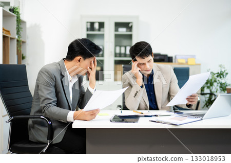 Frustrated manager scolds employee in office over financial error. Concept of workplace stress, reporting issues, conflict 133018953